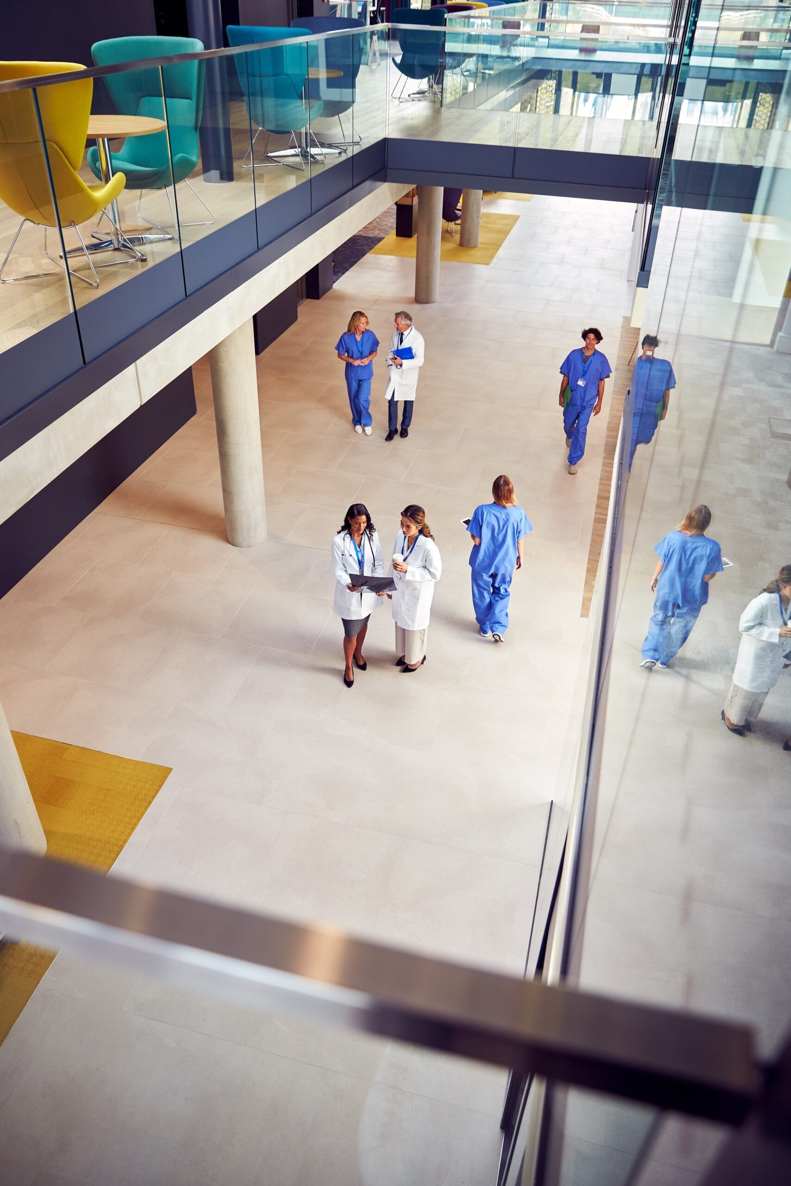 Overhead,Shot,Of,Two,Female,Medical,Staff,In,White,Coats